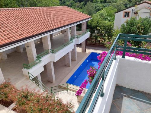 an aerial view of a house with a swimming pool at Renome in Petrovac na Moru