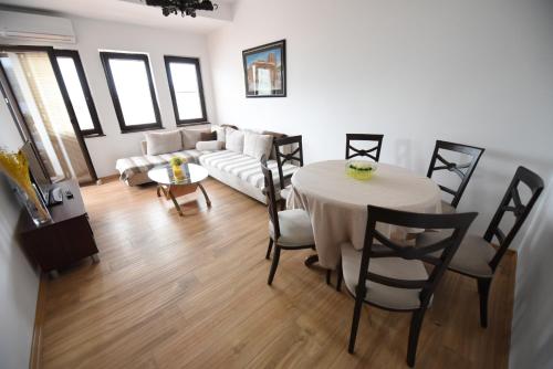 a living room with a table and a couch at Jovanovic Guest House in Ohrid