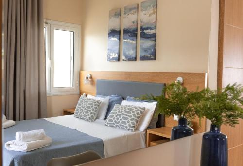 Postel nebo postele na pokoji v ubytování Theano Hotel