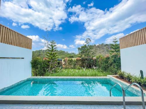 a swimming pool in the backyard of a house at The X10 Nordic Tent and Glamping Pool Villa Khaoyai เขาใหญ่ - SHA Certified in Ban Thung Sawang