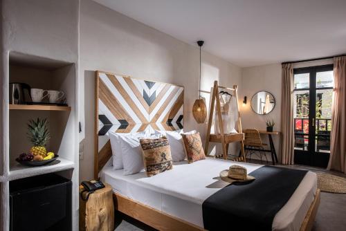 Postel nebo postele na pokoji v ubytování Indigo Inn Casa Adults Only