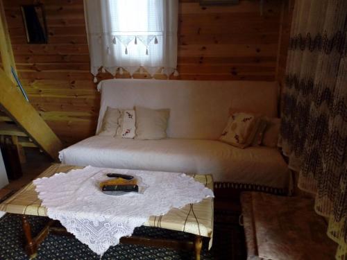 a living room with a couch and a table at Veličanka in Ulcinj
