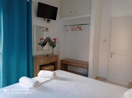 Ένα ή περισσότερα κρεβάτια σε δωμάτιο στο KELLY APARTMENTS