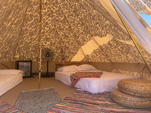 a bedroom with two beds in a tent at Simos Camping Elafonisos & Bungalows in Elafonisos