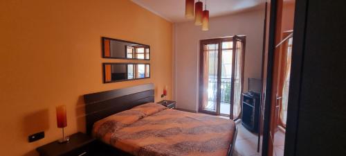 a bedroom with a bed and a television in it at Casa Marco in Praia a Mare