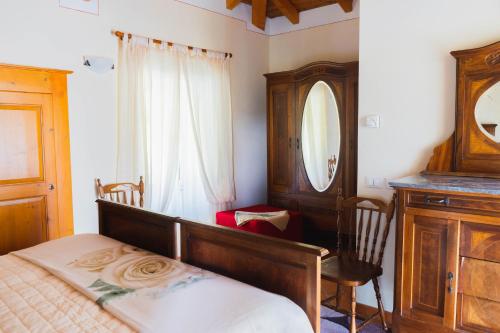 Giulietta e Romeo - Bed and Breakfast tesisinde bir odada yatak veya yataklar