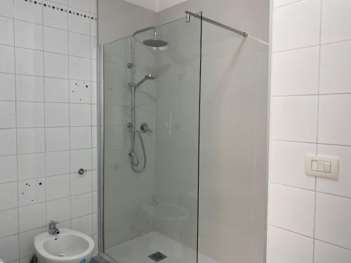 a bathroom with a shower and a toilet and a sink at Napoli Residence Casalnuovo in Casalnuovo di Napoli