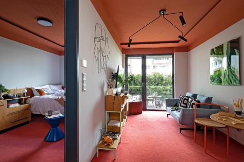 a bedroom and living room with a bed and a table at SmartApart in Budapest