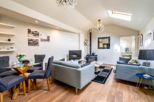 a living room with a couch and a table at Moatside Gate in York