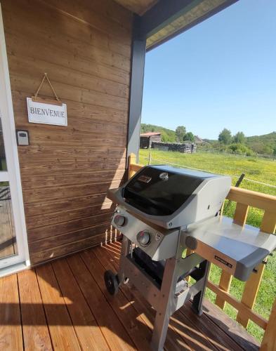 a grill on a porch with a sign that reads haymaker at Gîte, aux portes du Morvan in Voudenay-lʼEglise