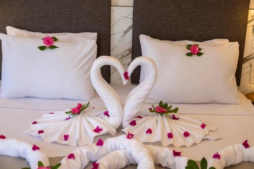 Postel nebo postele na pokoji v ubytování Orcey Hotel