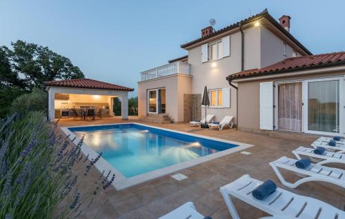 a swimming pool in the backyard of a house at Villa Buroli with Pool, Sauna and Jacuzzi in Buroli