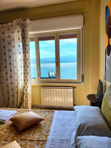 Ένα ή περισσότερα κρεβάτια σε δωμάτιο στο B&B Il MappaMondo