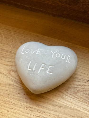 a heart shaped rock with the words love your life at Niedźwiedzia Dolina in Przybyszów