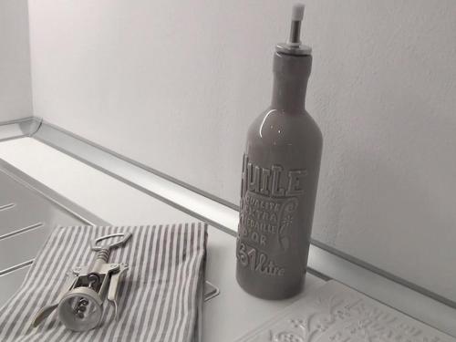 a bottle of wine sitting on top of a counter at Les Suites di Parma in Parma