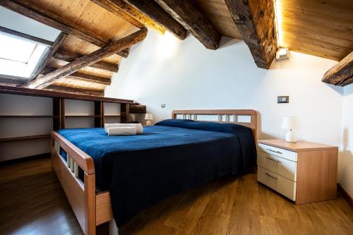 Un pat sau paturi într-o cameră la Collegio AMDG