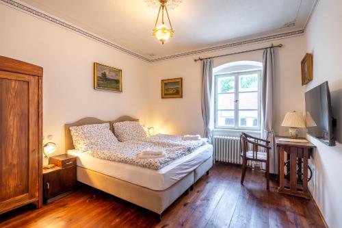מיטה או מיטות בחדר ב-Villa Waldhaus