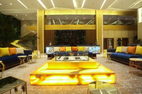 a lobby with a couch in the middle of a building at Oriental Palace by Agora Complex in Taza