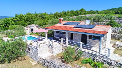 an overhead view of a house with solar panels on it at Holiday Home Zule in Žrnovo