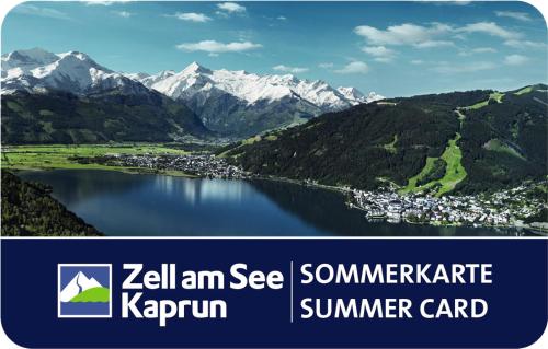 a picture of a lake with mountains in the background at Pension Max in Zell am See