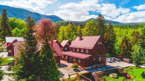 an aerial view of a large house in the woods at Wilczy Wodospad in Karpacz