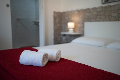 Ένα ή περισσότερα κρεβάτια σε δωμάτιο στο Case Vacanza La Pajara