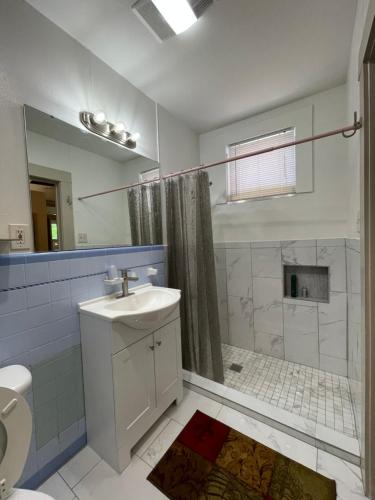 a bathroom with a sink and a shower and a toilet at 1322-#6 Downtown high ceiling big size 1B unit in San Antonio