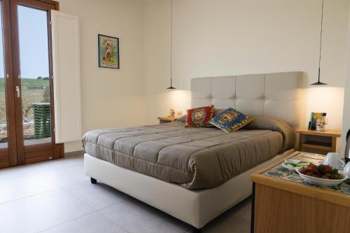 Letto o letti in una camera di La Corte del Sole