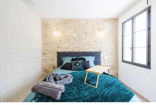 Ένα ή περισσότερα κρεβάτια σε δωμάτιο στο L'indiscrete Love Room - Hammam-Sauna-SPA