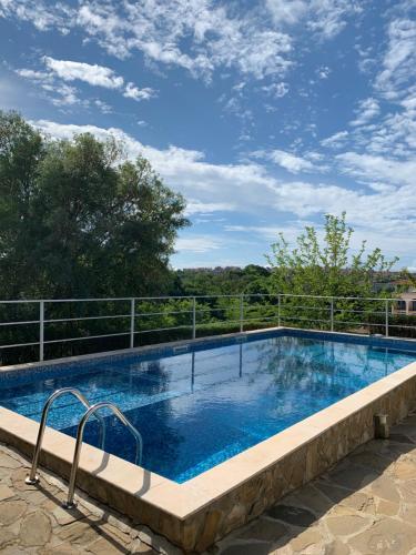 a large swimming pool on top of a building at Апартамент Silver Star in Sozopol
