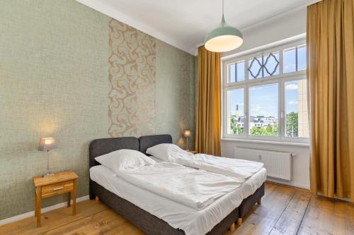 Ένα ή περισσότερα κρεβάτια σε δωμάτιο στο Dresden Neustadt Apartments