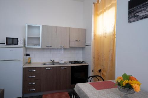 Η κουζίνα ή μικρή κουζίνα στο Case Vacanza La Pajara