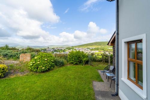 a view from the balcony of a house with a yard at Dingle View - 37 Tír Na Fiuise in Dingle
