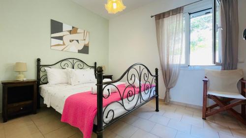 a bedroom with a bed with a pink blanket on it at Panoramic sea view1bedroom Apart.Glyfada beach2-4p in Glyfada