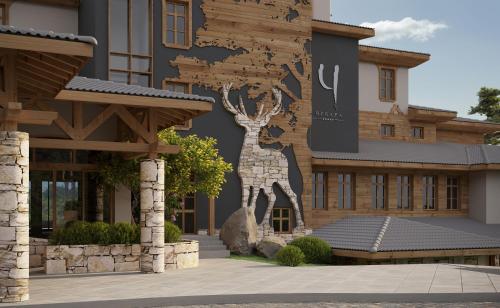a building with a mural of a giraffe on it at Wine & SPA Hotel Chukara in Tryavna