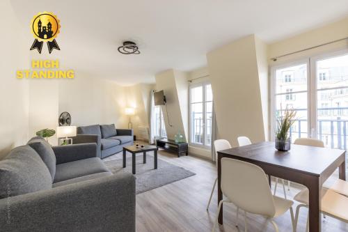 a living room with a couch and a table at Sweet Family Vacations - Fairytale Factory in Chessy