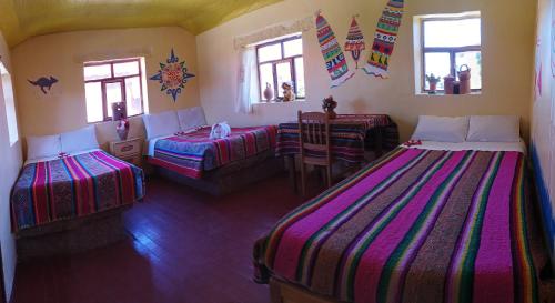 Hospedaje Rural La Florida en Llachon, Titicaca 객실 침대