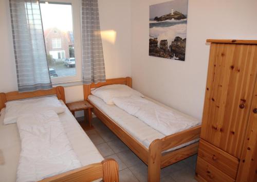 Postel nebo postele na pokoji v ubytování Leuchtturm