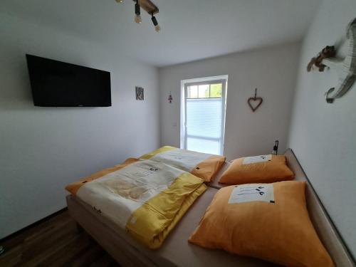 Postel nebo postele na pokoji v ubytování Grachtendrööm