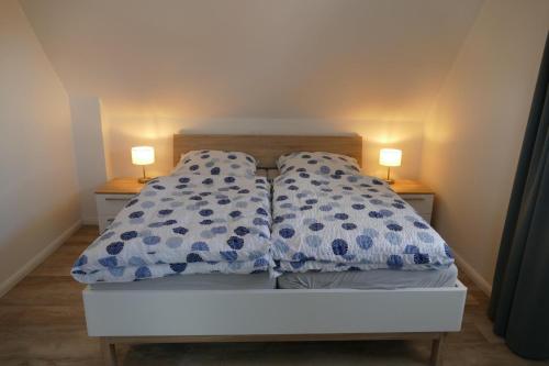 Кровать или кровати в номере Wellenbrecher