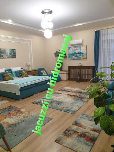 a green pole in a living room with rugs at IMPERIAL ROOMS - ULTRACENTRAL - jacuzzi cu hidromasaj in Oradea