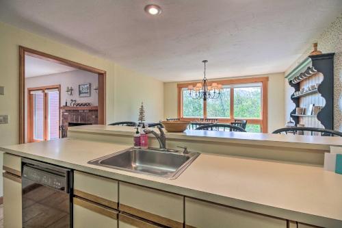 a kitchen with a sink and a counter top at Timber Creek Townhome with 2 Decks and Mtn Views! in West Dover