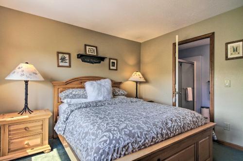 a bedroom with a bed and two lamps on a night stand at Timber Creek Townhome with 2 Decks and Mtn Views! in West Dover