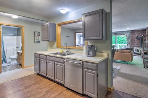 a kitchen with a sink and a counter top at North Conway Condo in the White Mountains! in North Conway