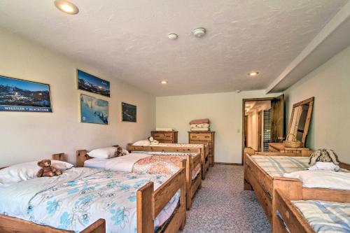 a bedroom with four beds in a room at Timber Creek Townhome with 2 Decks and Mtn Views! in West Dover