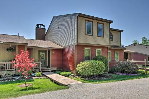 a house with a wooden ramp in front of it at Timber Creek Townhome with 2 Decks and Mtn Views! in West Dover