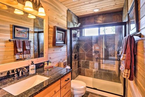 a bathroom with a shower and a sink and a toilet at Jefferson Cabin with Fire Pit Near Hiking Trails! in Bordenville