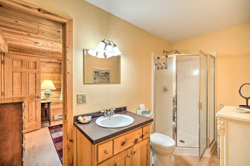 a bathroom with a sink and a shower and a toilet at Waterfront Escape w/ Fire Pit in Crosslake! in Cross Lake