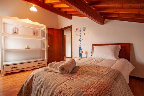 Кровать или кровати в номере Casa da Porta Amarela