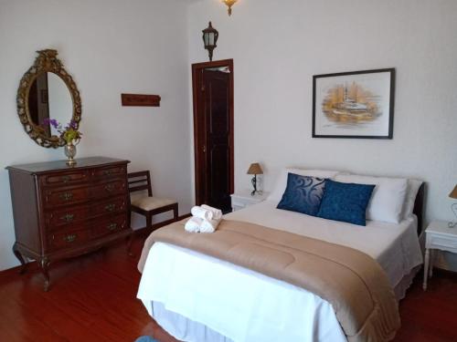 A bed or beds in a room at Pousada Canto da Paz